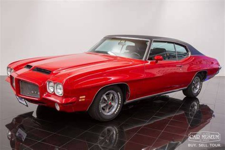 A 1971 Pontiac GTO is one of the many muscle cars Cena owns