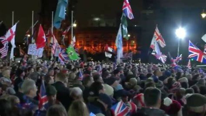  A Brexit supporter sports the Union Jack outside the Houses of Parliament