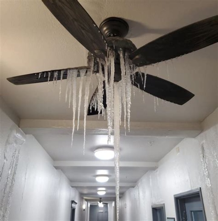 A ceiling fan with icicles hanging from it in an apartment building in Upper Dallas, Texas, after a power cut saw millions of people without heat