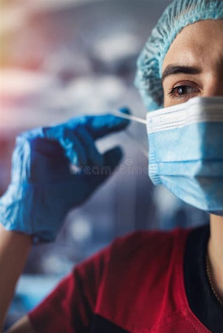 A doctor at work removing the worms