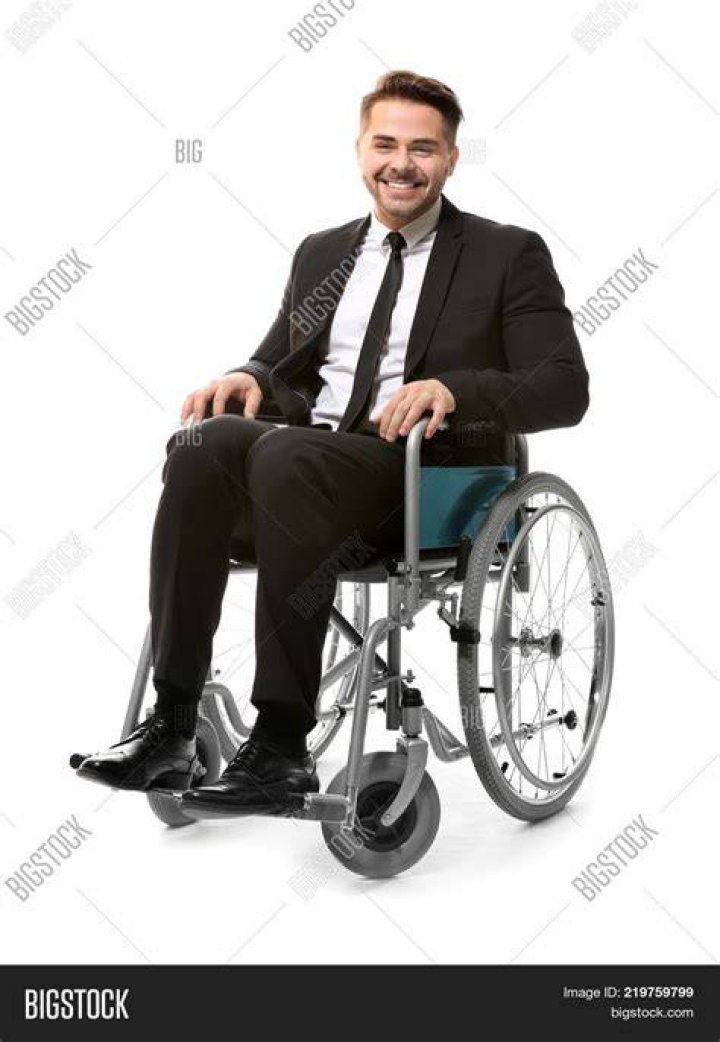 A man in a wheelchair held a metal bat and yelled at the soldier: 'Are you hitting people? Are you hitting our people?'