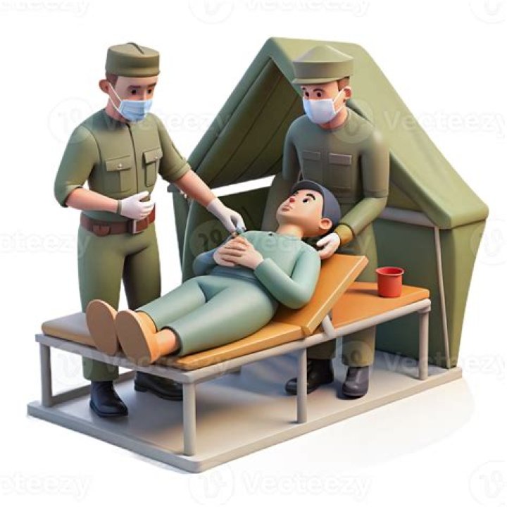 A medic tends to a bleeding man in a makeshift clinic in Iraq