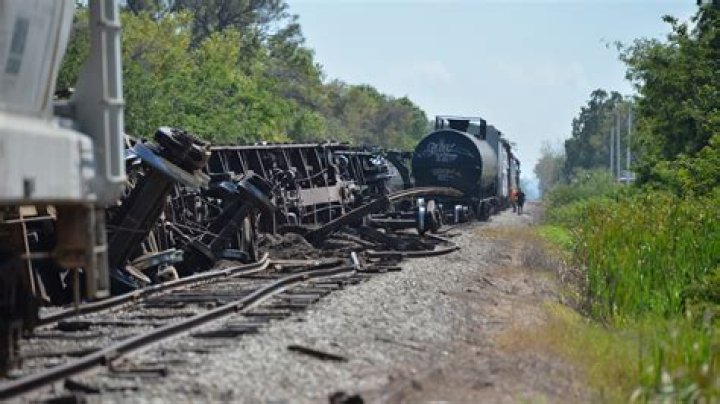 A piece of the derailed train is seen alongside the tracks after the collision