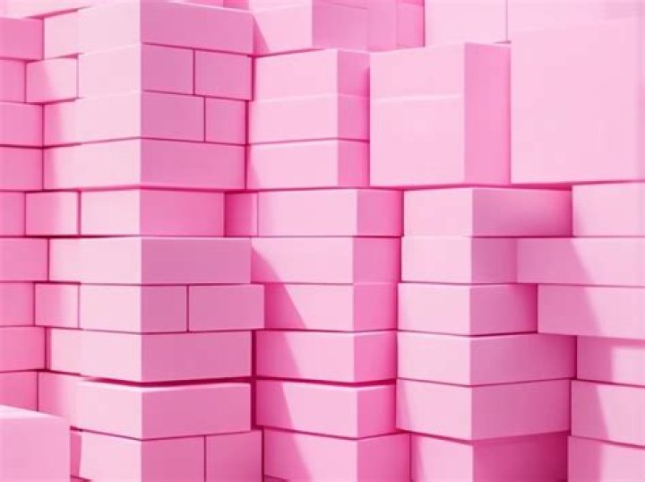 A pink block-like structure made from wood was erected