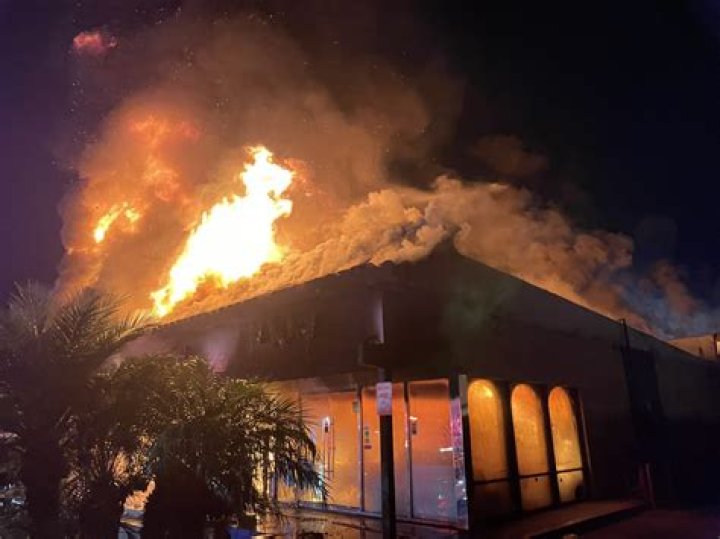 A shopping mall burns during the second day of the LA riots