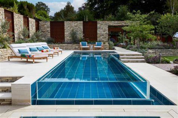 A stunning swimming pool is the focal point of the four-bed villa