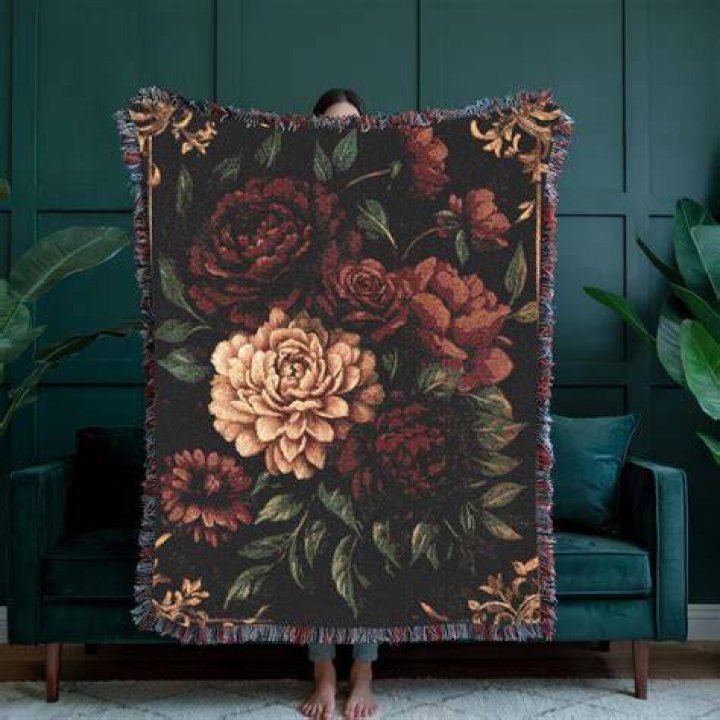 A vintage blanket has dark red stains