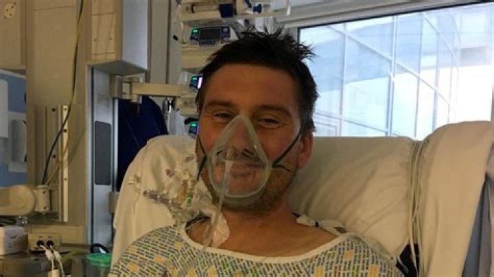 Adam Martin recovering in hospital after having open heart surgery which he needed after developing an infection in his heart - caused by popcorn