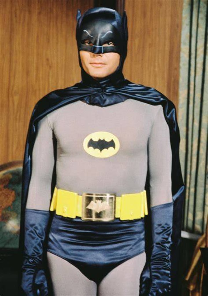 Adam West as Batman and Sally James as Robin in 1976; Ward said West had to 'stuff turkish towels' in his underpants
