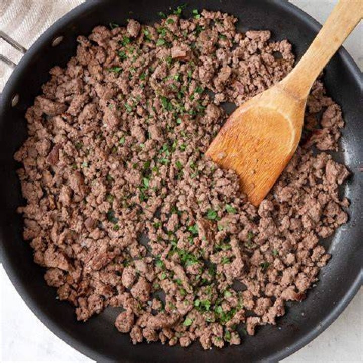 Add the beef to the middle of one of the pieces of puff pastry