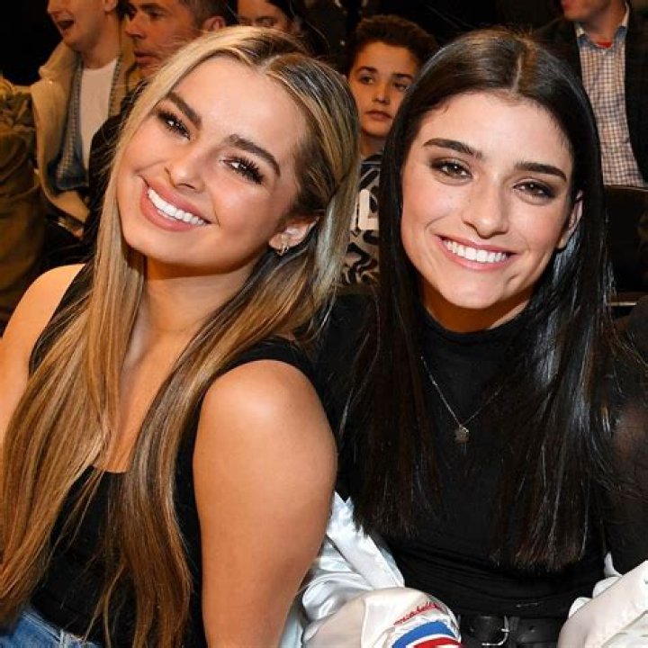 Addison Rae, Dixie D&rsquo;Amelio, Charli D'Amelio, and fellow influencer Chase Hudson pose for the cameras at an NBA game