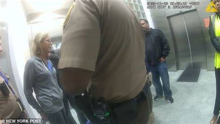 Adelson, 73, is seen being escorted out of the Miami International Airport in the video released on Tuesday