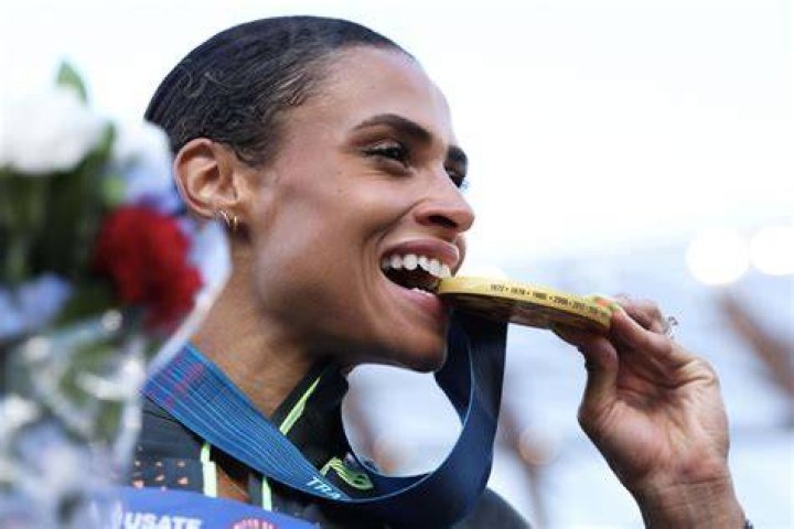 After qualifying for the Olympics, Richardson famously ran into the stands to hug her grandmother who raised her.