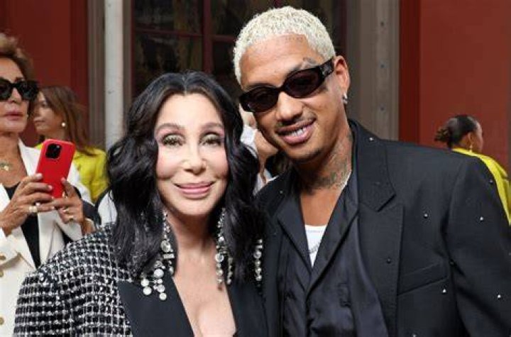 Alexander Edwards and Cher at the Versace Fall/Winter 2023 Fashion Show on March 9, 2023, in Los Angeles, California