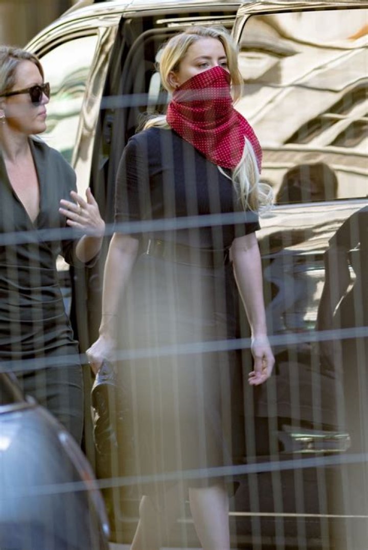 Amber Heard arrives at court to face her ex-husband
