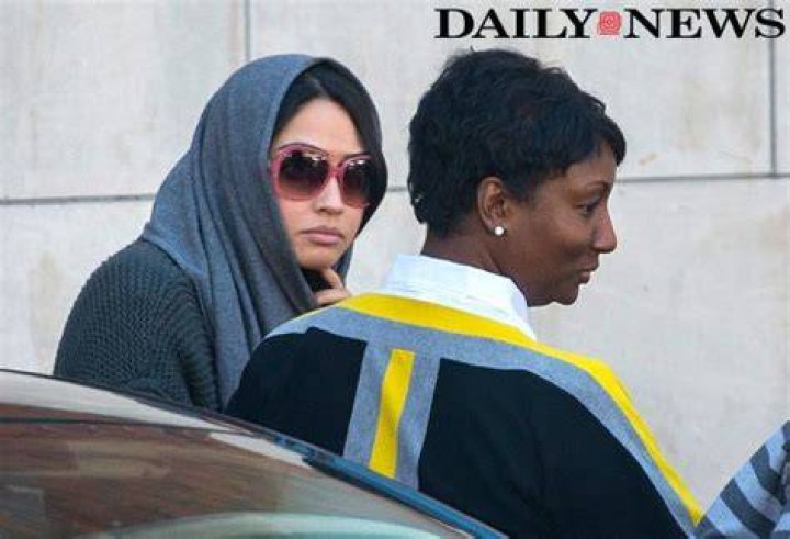  Ambra, seen with a lawyer, described how women were asked to kiss a pagan statue's penis