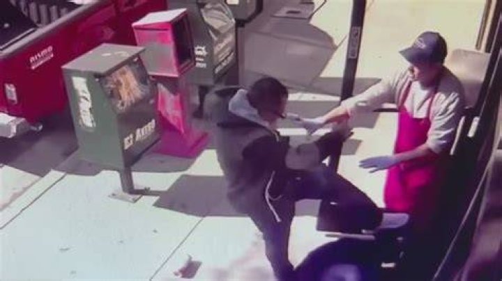 An elderly man being attacked while walking his dog
