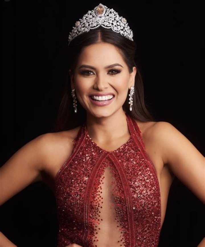 Andrea Meza, a model and software engineer, wore a dazzling red gown as she accepted the award