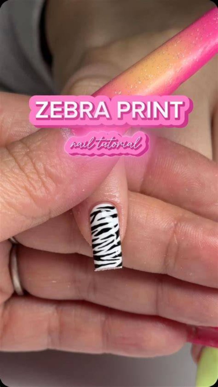 Ashley modeled a zebra-print dress