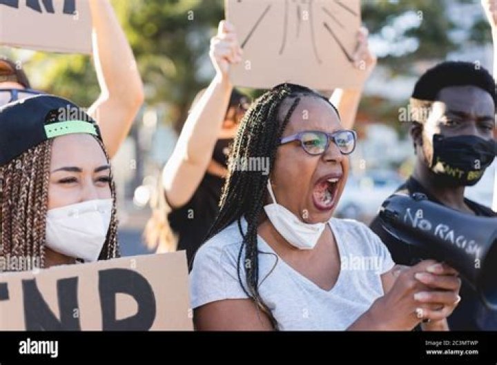 Black Lives Matter demonstrators are seen at the corner of Legion Lane in Columbus, near where Ma'khia was fatally shot