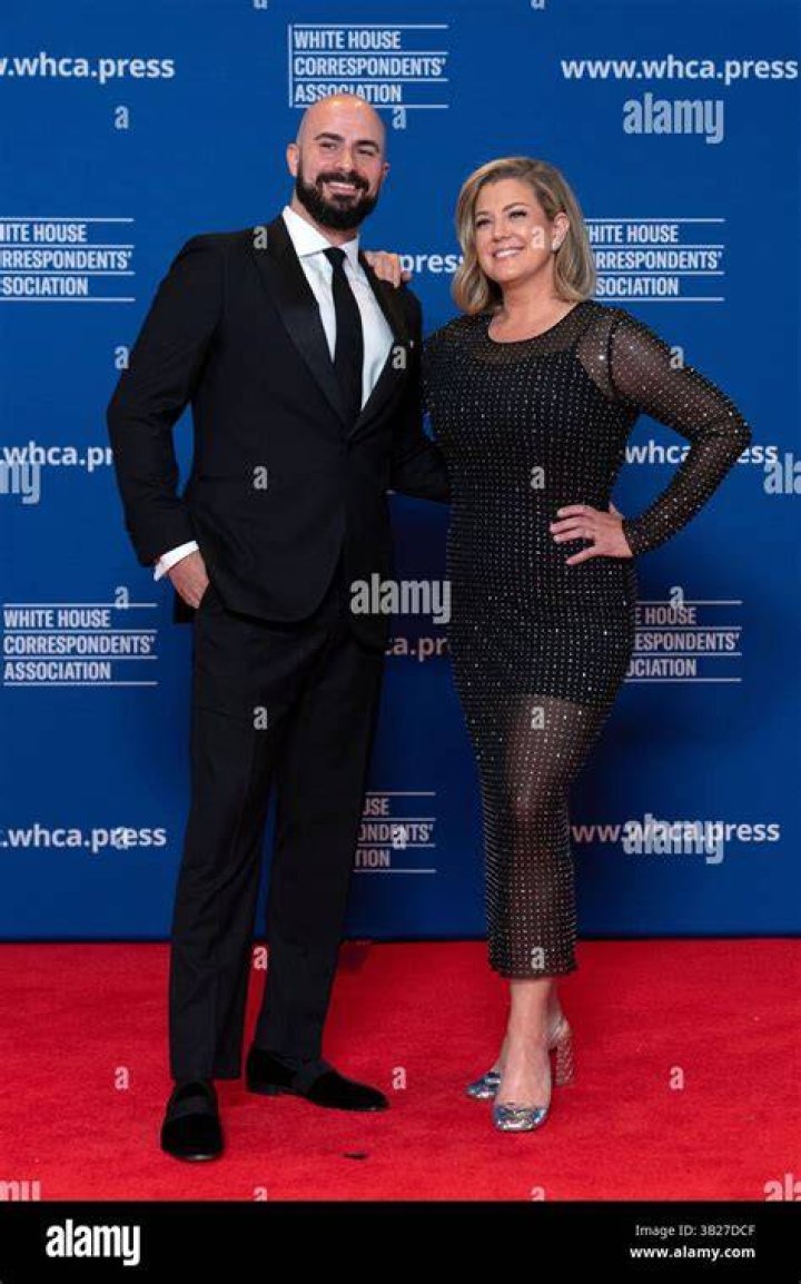 Brianna Keilar poses for a photo alongside her husband Fernando Lujan, stepson Teddy, and son Antonio