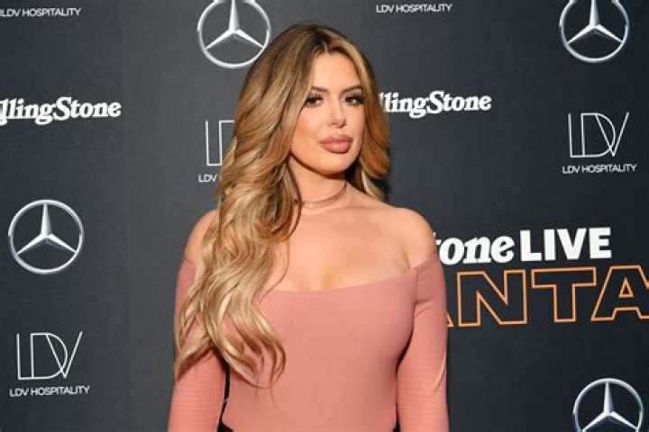 Brielle stunned in a barely-there pink bikini during a tropical getaway 