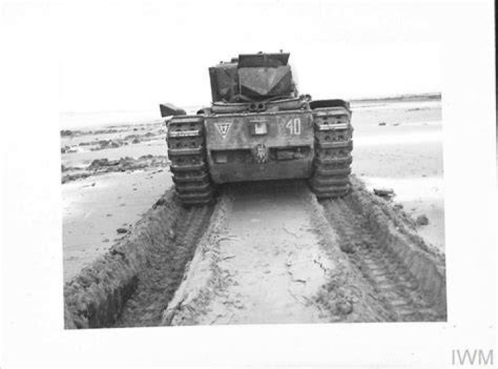  British 79th Armoured Division LVTs (Buffaloes) transport infantrymen through floodwaters after the Germans destroyed dykes on 5 February