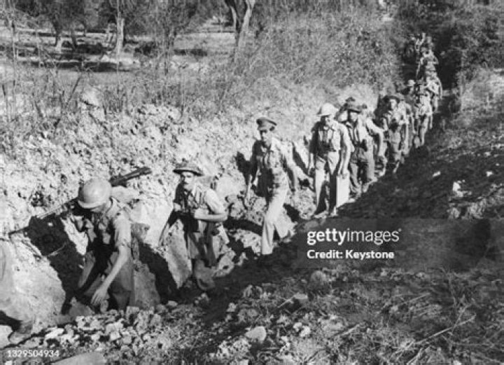  British infantrymen in trenches along the Maas River' west bank in late November