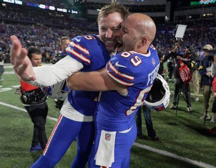 Buffalo Bills players react as Hamlin is examined during the first half of an NFL football game against the Cincinnati Bengals on January 2, 2023