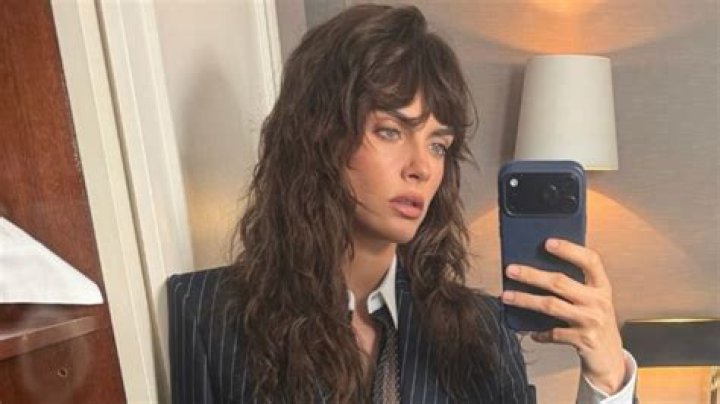 Cara Delevingne made a statement in an all-white ensemble with a bold red message