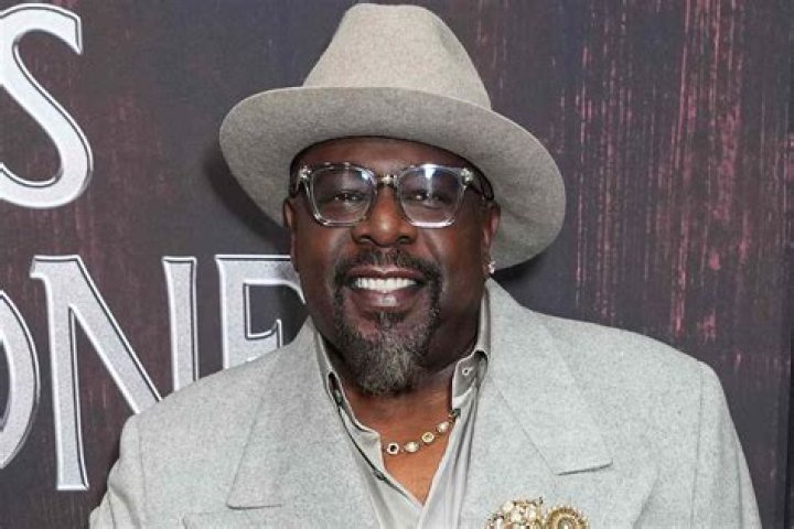 Cedric the Entertainer added a pop of color to the carpet