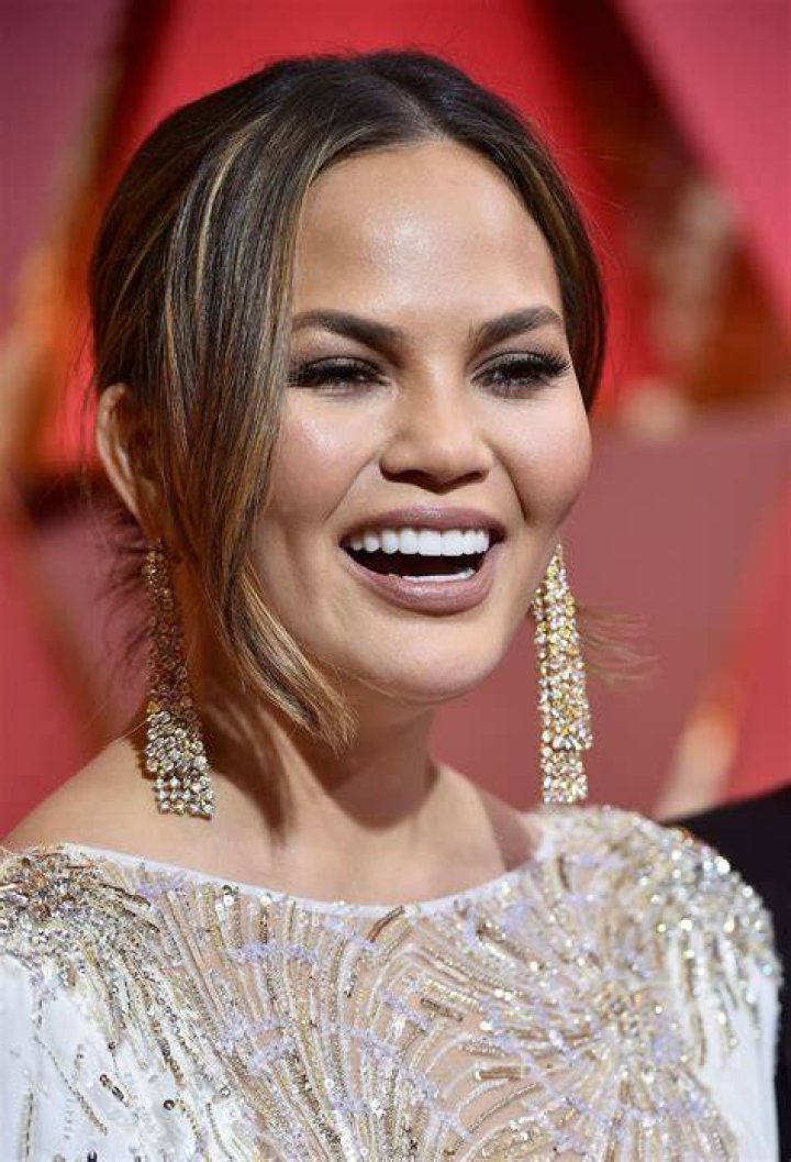Chrissy Teigen, pictured in 2017, has revealed she is getting her boob implants removed