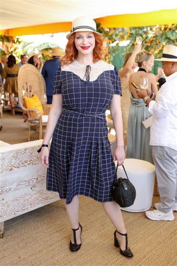 Christina Hendricks Veuve Clicquot Polo Classic Wearing Reformation Floral Flower Dress Sun Hat