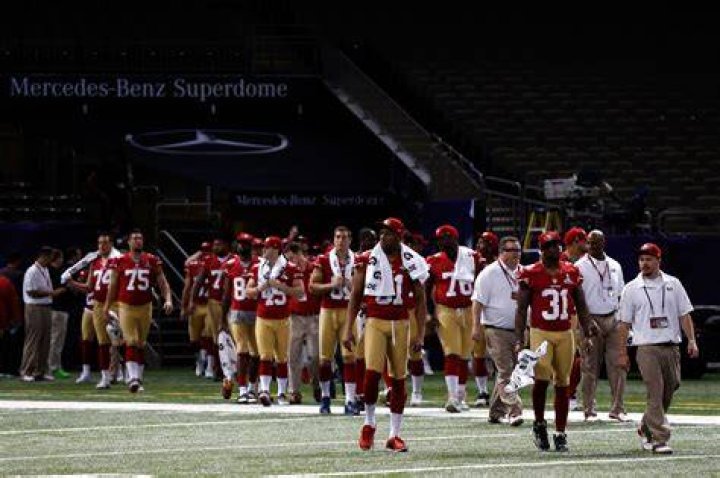 Clark Haggans #51 and the San Francisco 49ers arrive for Super Bowl Media Day