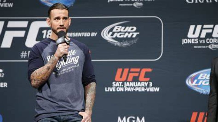 CM Punk with MMA coach Duke Roufus, Zelina Vega and Malakai Black