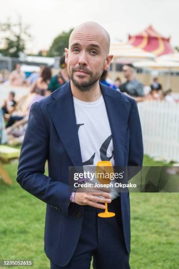 Comedian Tom Allen, who's co-hosting the social media with Emily, turned out in a full suit in sweltering temperatures 