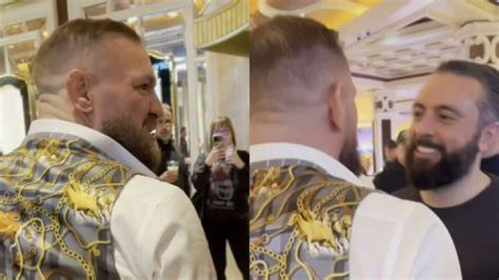 Conor McGregor poses with fan with his face tattooed on forearm