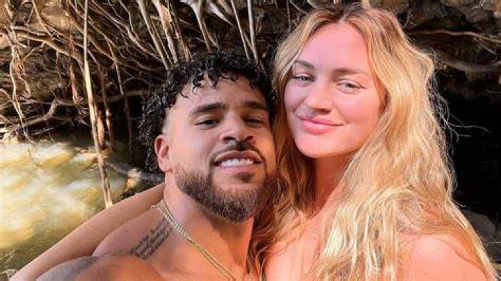  Cory Wharton and Taylor Selfridge pose together on a rooftop