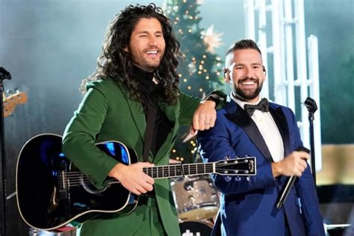 Dan + Shay pictured with their wives Abby Law and Hannah Billingsley at the 2019 CMA Awards
