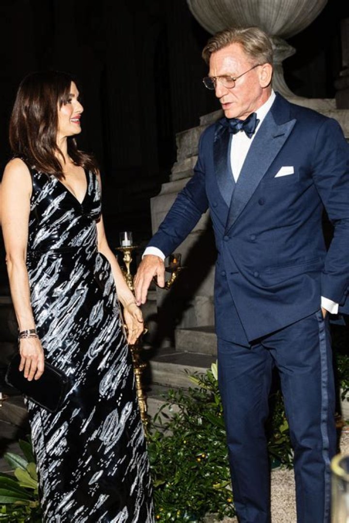 Daniel Craig (R) and Rachel Weisz (L) put on a chic front as they attended the sporting event