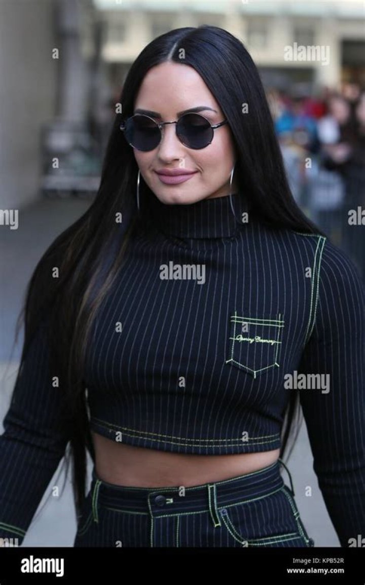 Demi was seen at a Milan Fashion Week event in a plunging blazer top last week