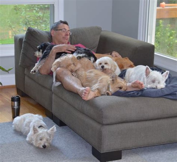  Dog and Francie cuddle up by a lake near their home in Colorado