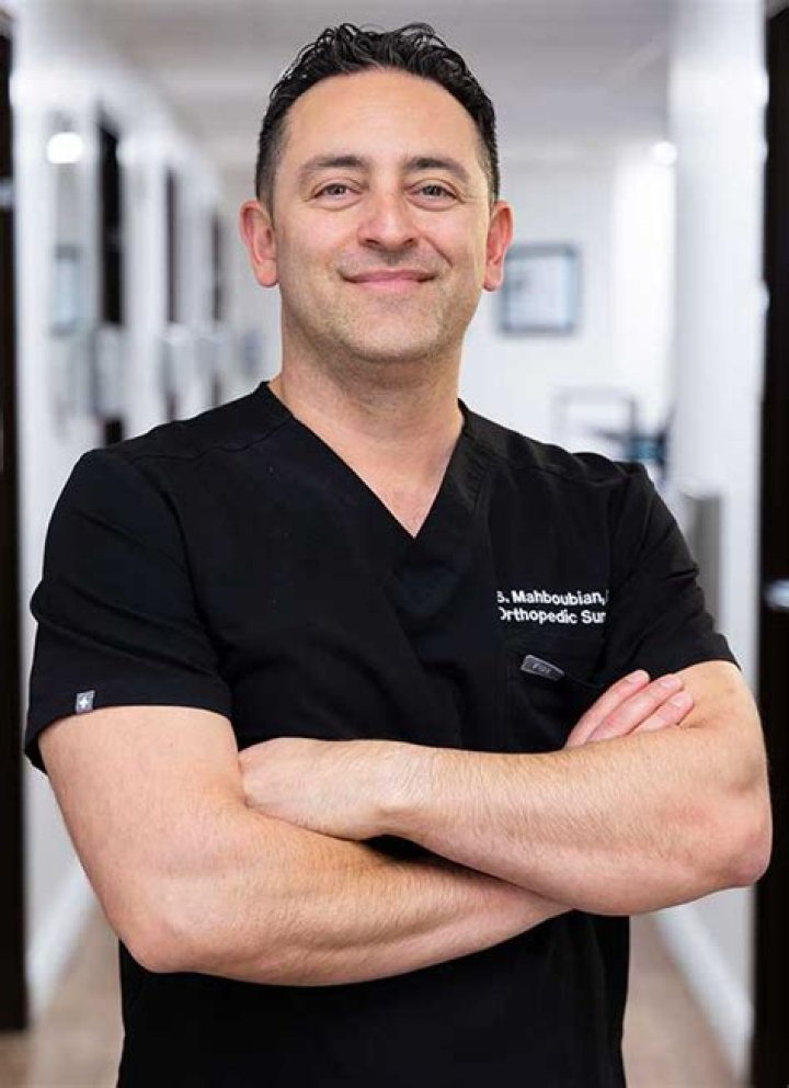 Dr Mahboubian is pictured above with two different clients that he has helped