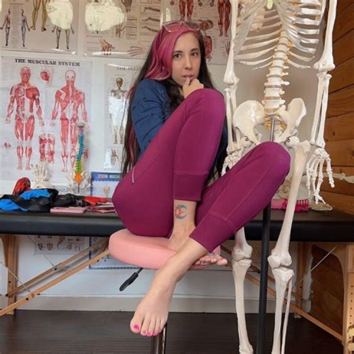 Dr. Misty Ray pulls off her work scrubs to reveal a bikini top underneath