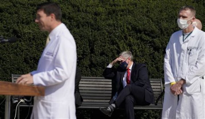Dr Sean Conely, centre, Trump's physician, wrote in a memo on Thursday that it would be 'safe' for the president to attend public events from Saturday if his health continues to improve