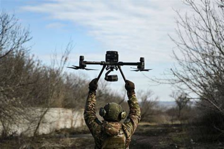 Drone footage shows the troops moving between the buildings
