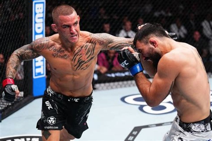 Dustin Poirier shows off his new piece of jewellery - which he vows to sell for charity