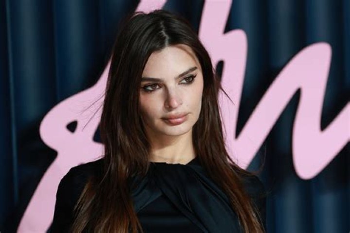 Emily Ratajkowski Puts an Unexpected Cowgirl Twist on Classic Silk Slip Dress at Christmas Party