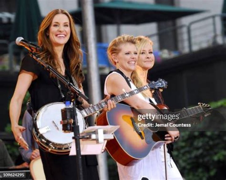 Emily Robison, Natalie Maines, and Martie Maguire of the Dixie Chicks pose for a photo as they arrive for an event in 1998 in Los Angeles, California