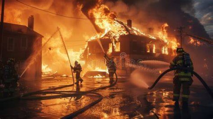Firefighters work to extinguish a fire in Alpine, California